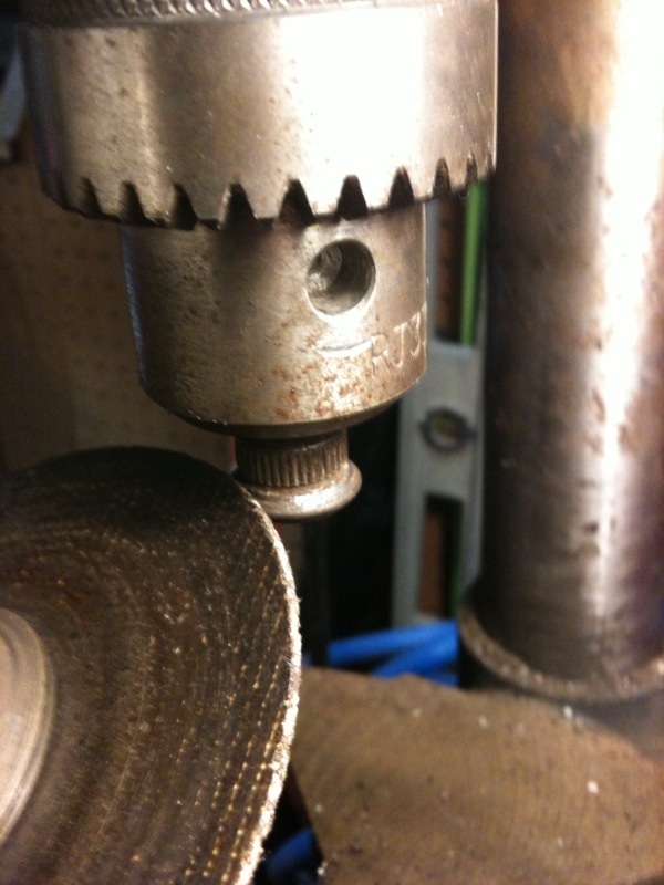 chamfering a stud head with a drill press and a grinder chamfering a stud head that needs it